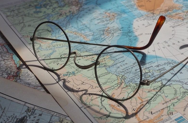 Round eyeglasses left on some world maps
